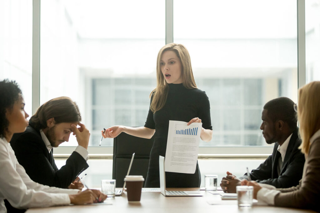 Business woman delivering bad news to her team