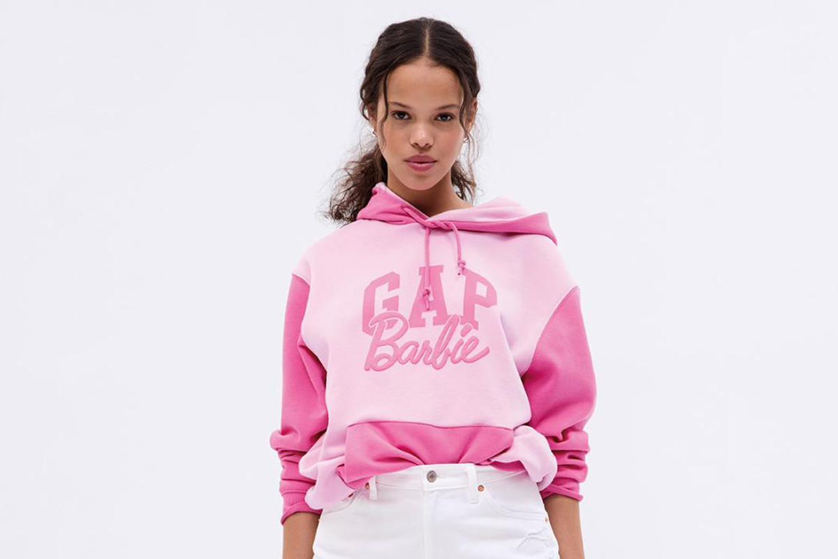 Young black woman wearing a pink Barbie/Gap hoodie