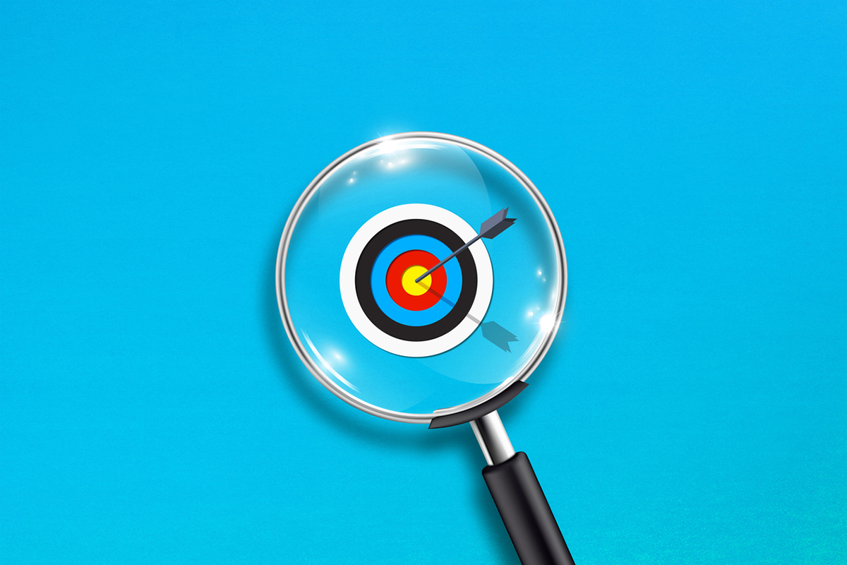 Strategic concept with magnifying glass and target on blue background