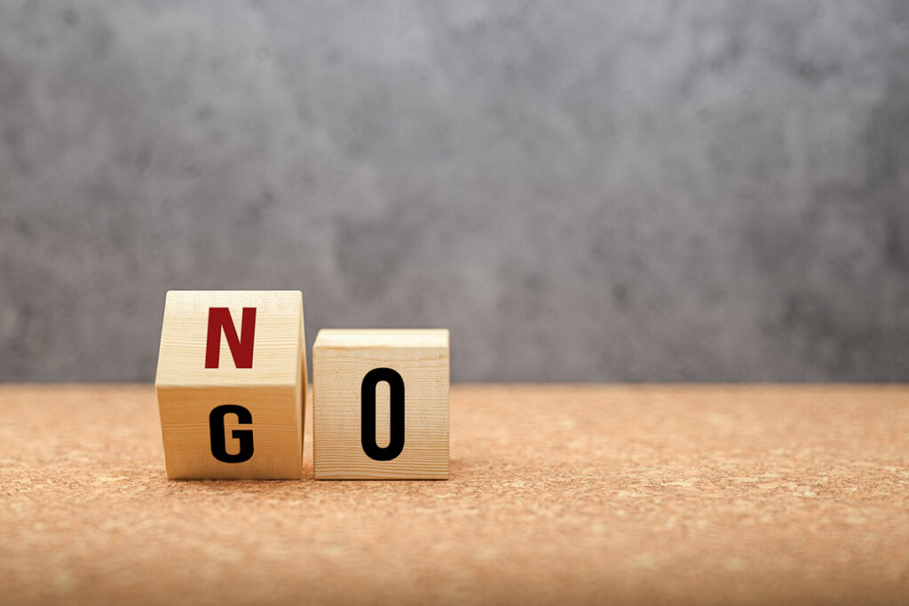 No versus Go concept with words on wooden cubes
