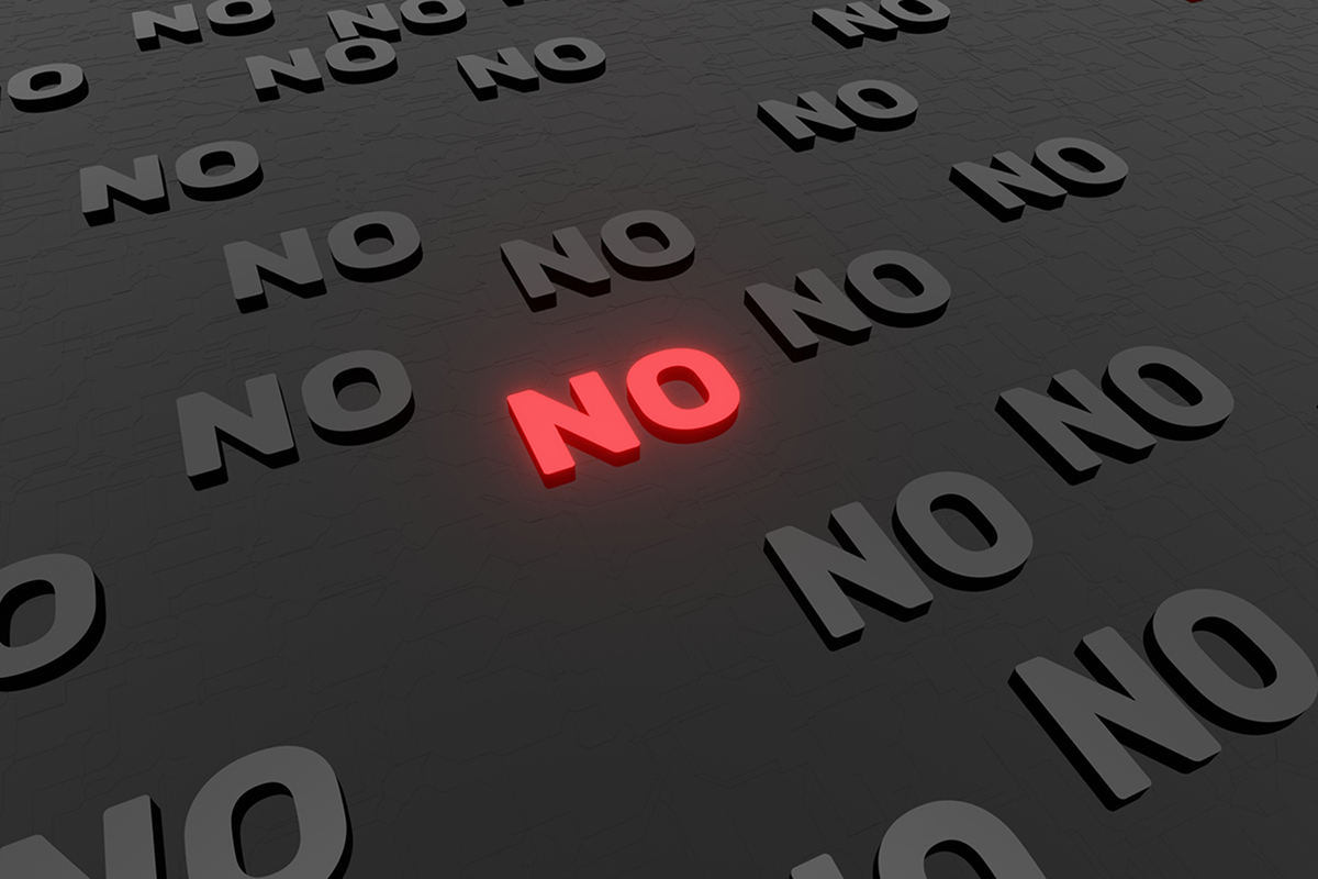 The word no in red letters on a black background. Illustration represents when a client says no to an idea.