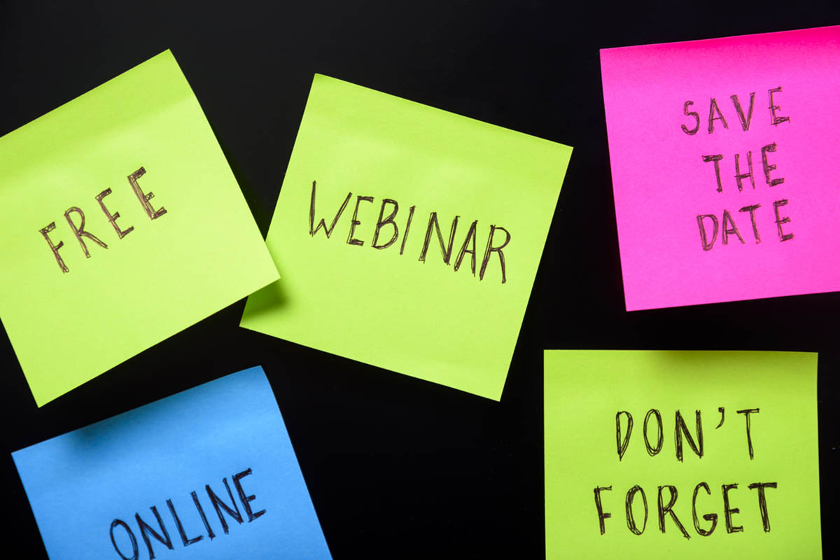 Black background with brightly colored post-it notes that have words about webinar promotions, illustrating the importance of having a webinar marketing strategy