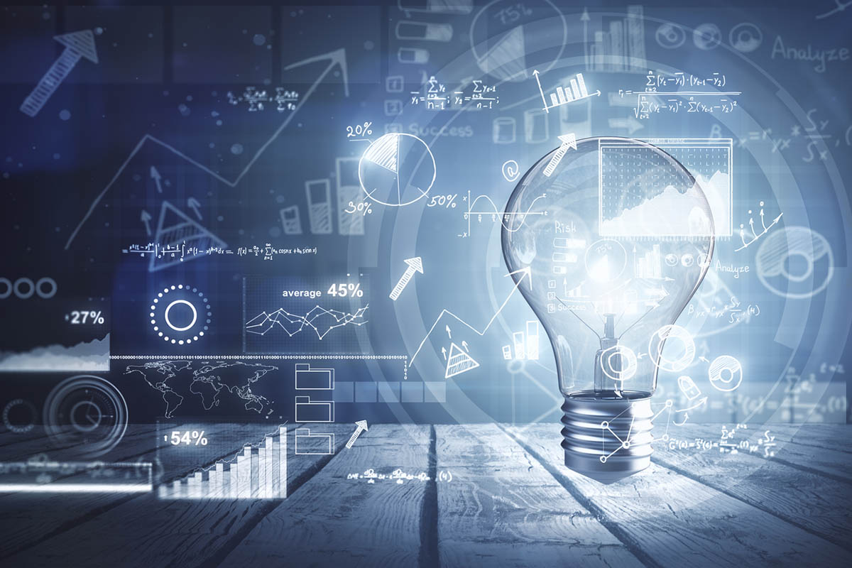 Ligtbulb glowing in front of data, figures and charts illustrating the power of creative insights in marketing