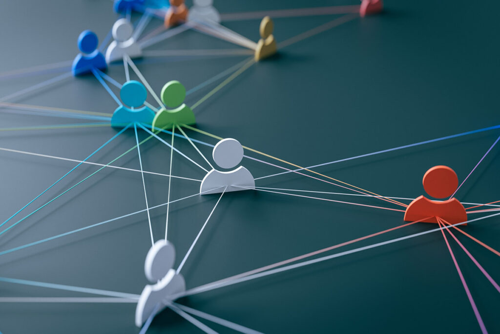Abstract network of colorful human icons connected by strings, representing collaboration, connection, and a strong customer engagement strategy.