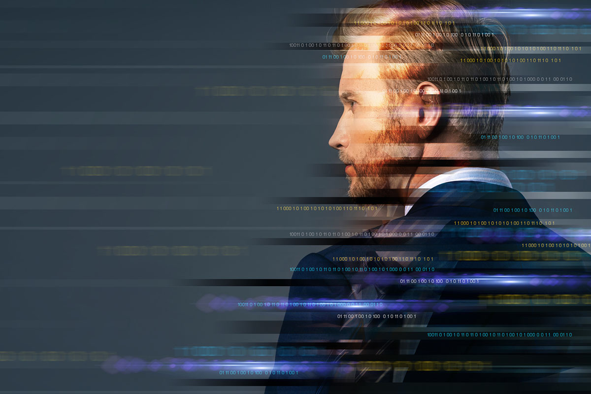 White businessman facing away with data streams passing on top of him illustrating a thought leader evaluating changing B2B marketing strategies.