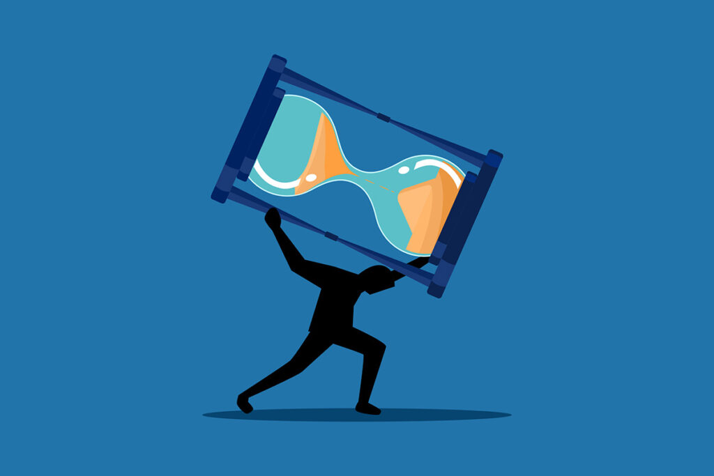 Silhouette of a person struggling to hold up a giant hourglass, symbolizing the power of waiting and the effort it takes to pause instead of pushing forward.
