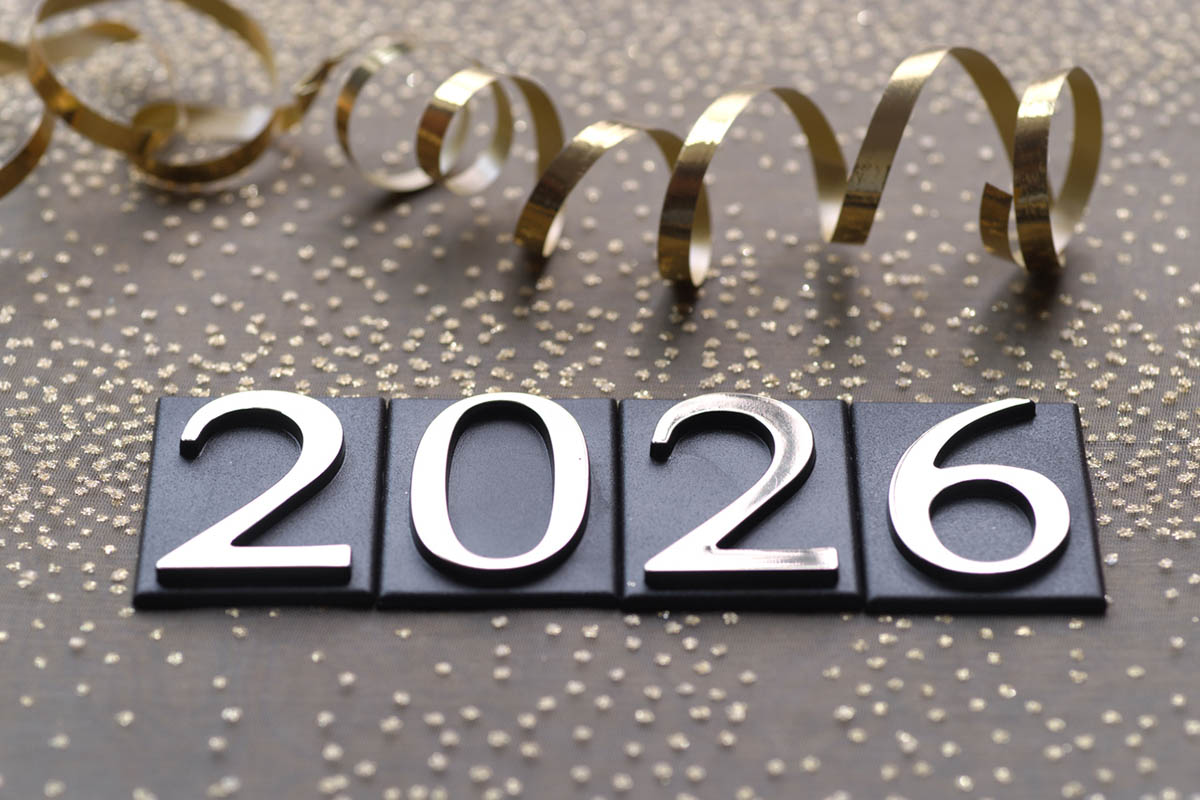 Decorative New Year image showing ‘2026’ with gold ribbon and confetti, representing plans for 2026 and a fresh start.