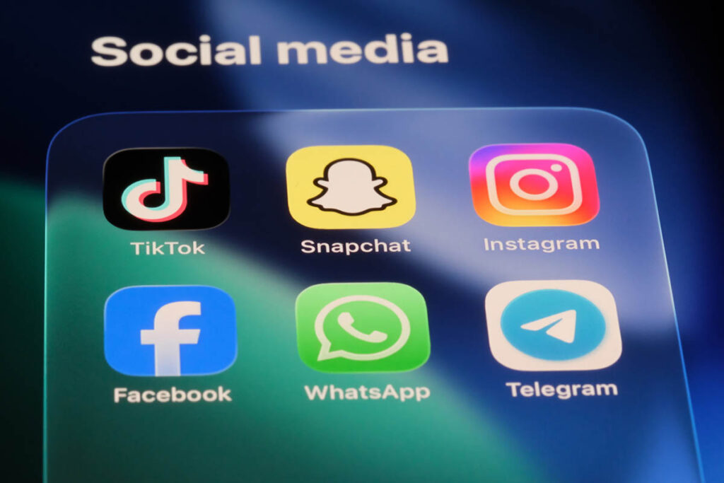 A smartphone screen displays popular apps including Snapchat, TikTok, Instagram, Facebook, WhatsApp, and Telegram, illustrating how to evaluate a social media platform based on audience fit rather than popularity alone.