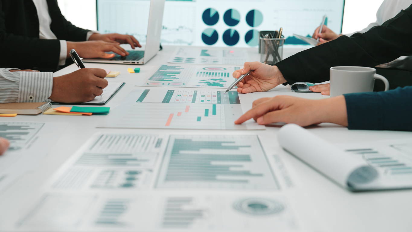 Collaborative meeting reviewing statistical reports