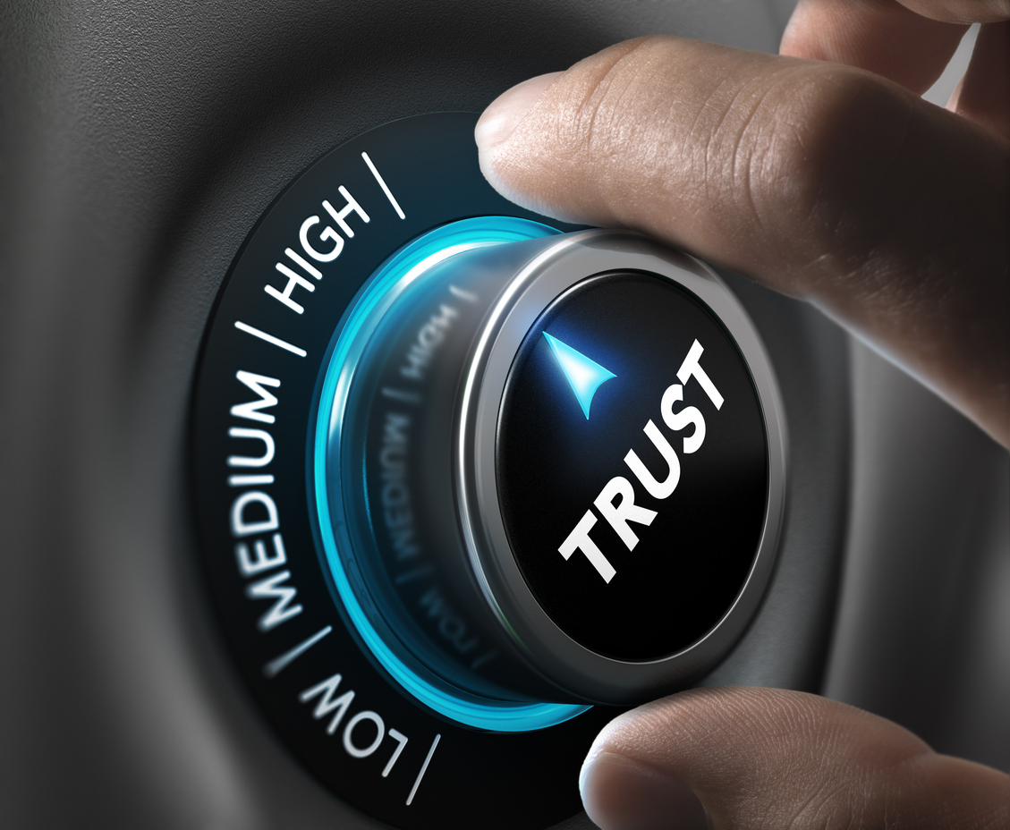 Man fingers setting trust button on highest position.